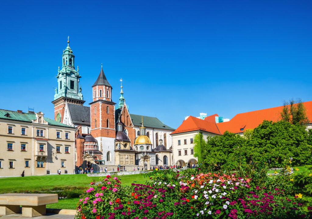 Wawel Castle and cathedral square with flowers in foreground in Krakow, Poland